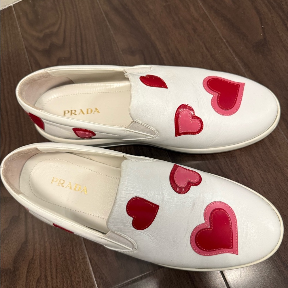 Prada White Slip-Ons with Red Heart Details